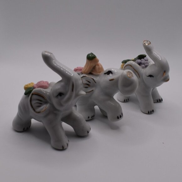 Other - 3 White Ceramic Elephants Carrying Flowers